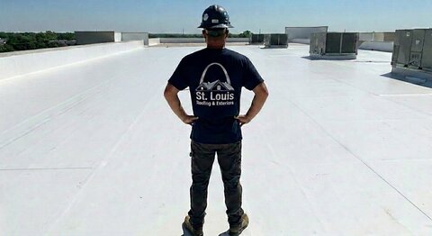 A completed white membrane roof on a commercial building.